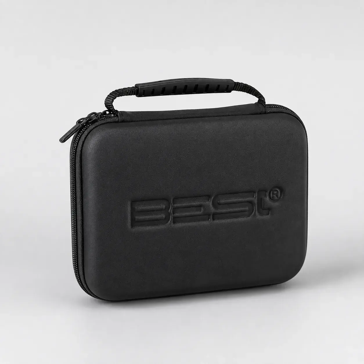 The closed travelling case, its handle up, the B-E-St mark embossed in the lid